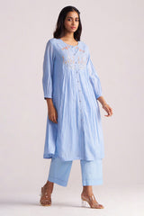 Woman wearing a Airy Blue Mul-Chanderi Co-ord Set on a plain background