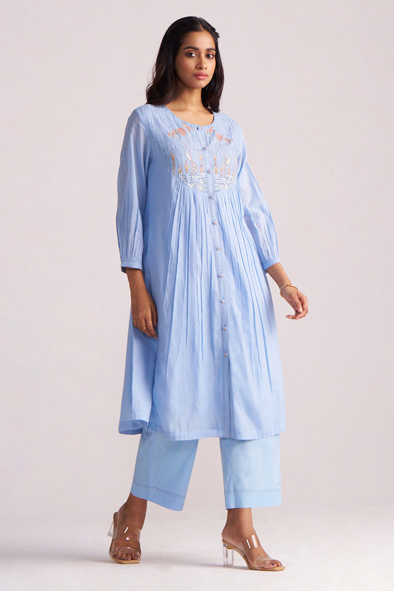 Woman wearing a Airy Blue Mul-Chanderi Co-ord Set on a plain background