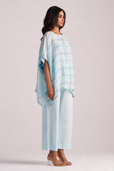 Woman wearing a Misty Blue Silk Kaftaan Co-ord Set on a plain background