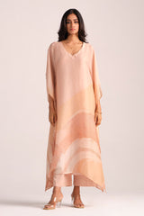 Woman wearing a Spanish Villa Silk Kaftaan Co-ord Set on a white background