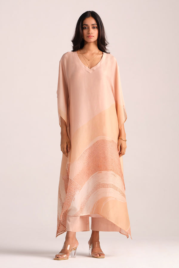 Woman wearing a Spanish Villa Silk Kaftaan Co-ord Set on a white background