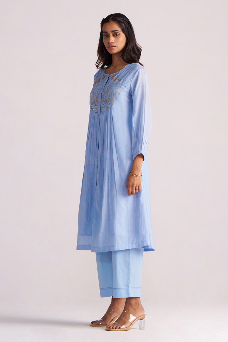 Woman wearing a Airy Blue Mul-Chanderi Co-ord Set on a white background