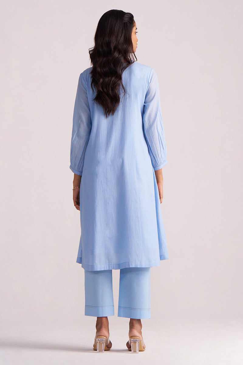 Woman wearing a Airy Blue Mul-Chanderi Co-ord Set on a plain background