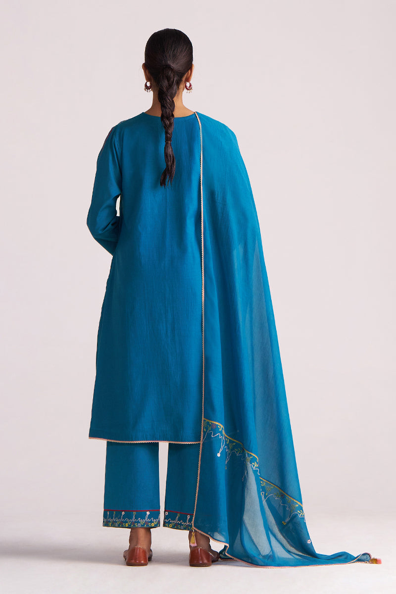 Woman wearing a Celestial Blue Embroidered Kurta Set on a white background