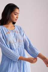 Woman wearing a Airy Blue Mul-Chanderi Co-ord Set against a plain background