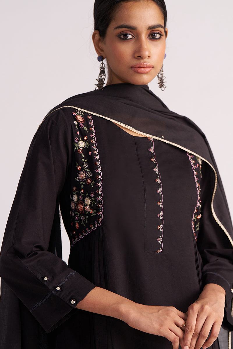 Woman wearing a Black Embroidered Kurta Set on a plain background