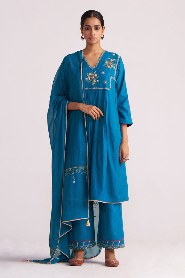 Woman wearing a Celestial Blue Embroidered Kurta Set outfit on a white background