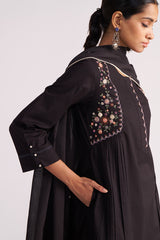 Woman wearing a Black Embroidered Kurta Set on a white background
