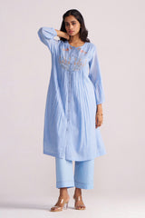 Woman wearing a Airy Blue Mul-Chanderi Co-ord Set on a plain background