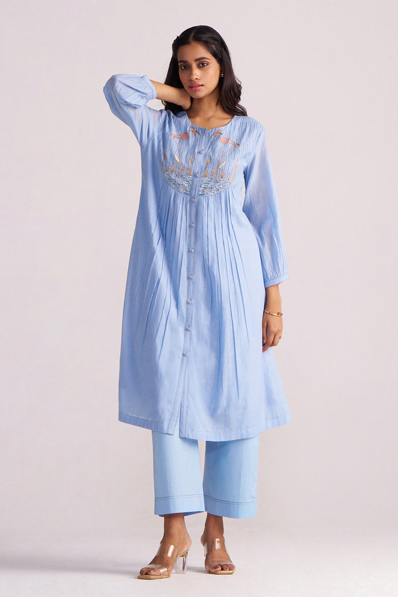 Woman wearing a Airy Blue Mul-Chanderi Co-ord Set on a plain background