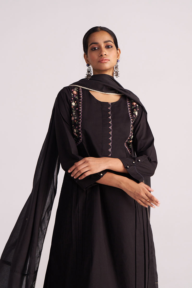Woman wearing a Black Embroidered Kurta Set on a light gray background