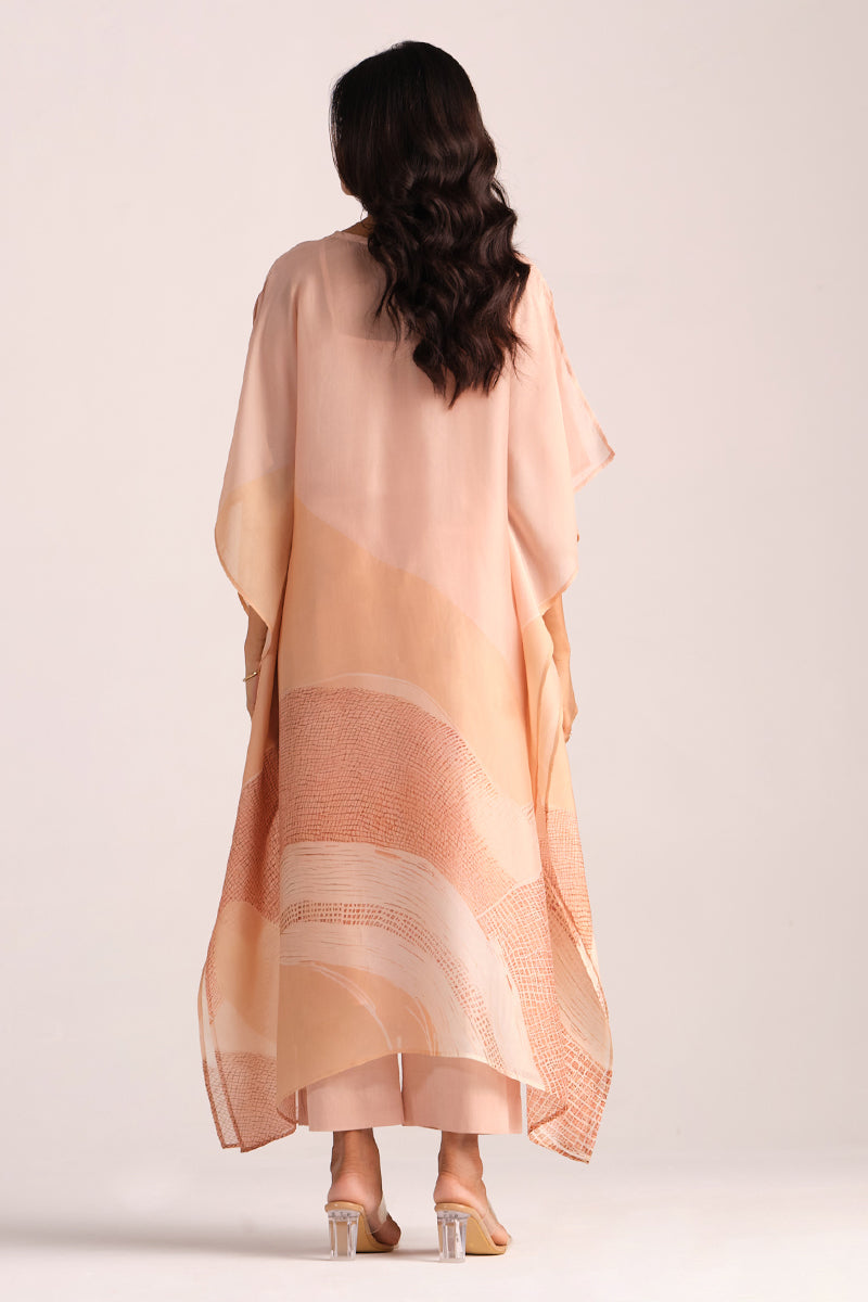 Woman wearing a Spanish Villa Silk Kaftaan Co-ord Set a plain background