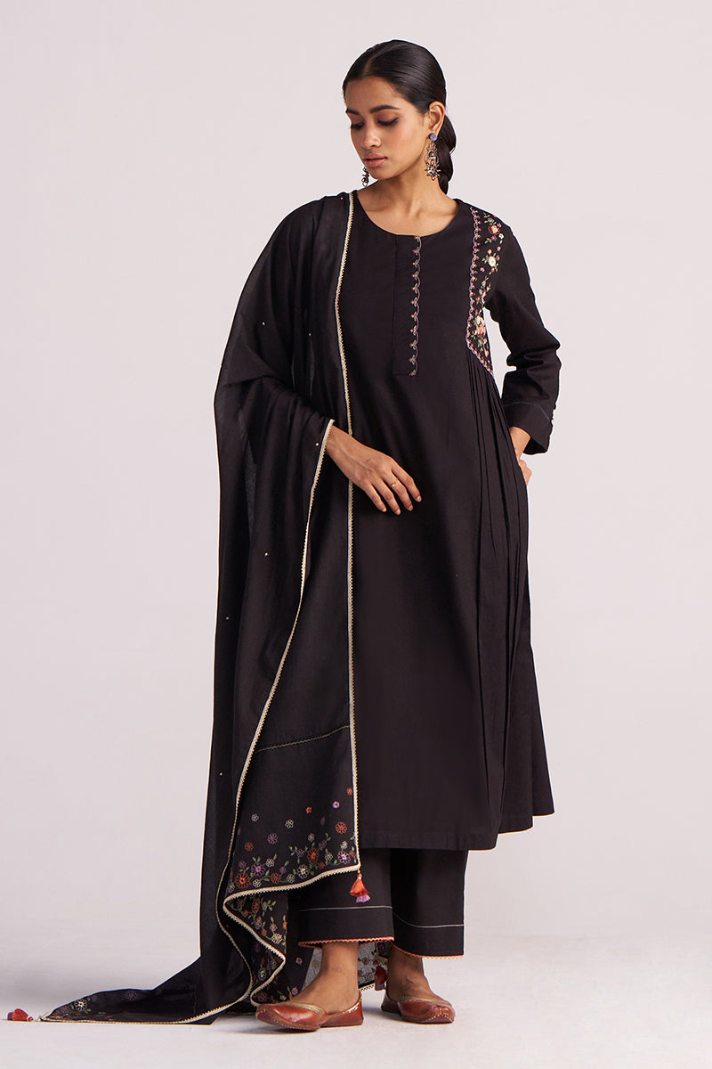 Woman wearing a Black Embroidered Kurta Set with embroidery on a white background