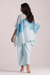 Woman wearing a Misty Blue Silk Kaftaan Co-ord Set on a plain background