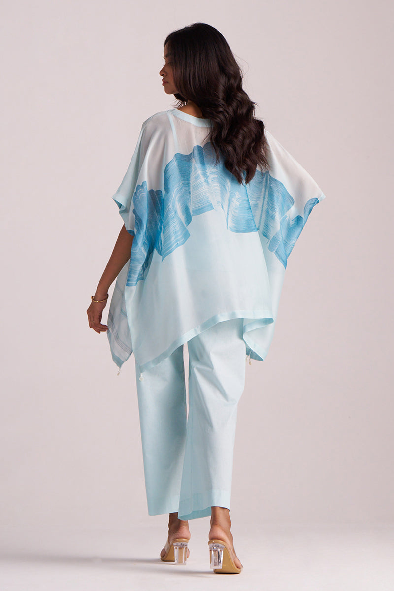 Woman wearing a Misty Blue Silk Kaftaan Co-ord Set on a plain background