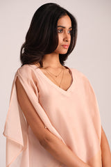 Woman wearing a Spanish Villa Silk Kaftaan Co-ord Set against a plain background