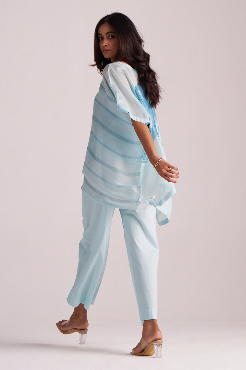 Woman wearing a Misty Blue Silk Kaftaan Co-ord Set on a plain background