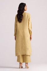 Woman wearing a Fall Leaf Pure Linen Co-ord Set on a light gray background