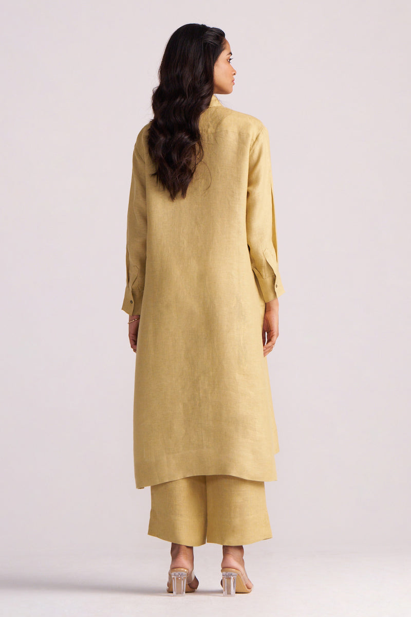 Woman wearing a Fall Leaf Pure Linen Co-ord Set on a light gray background