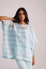 Woman wearing a Misty Blue Silk Kaftaan Co-ord Set against a plain background