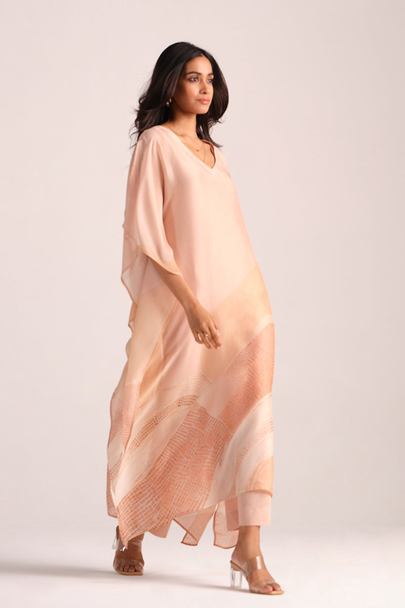 Woman wearing a Spanish Villa Silk Kaftaan Co-ord Set against a white background