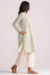 Woman wearing a Cream and Deep Olive Mughal Tree Hand Print Cotton-Linen Co-ord Set on a plain background
