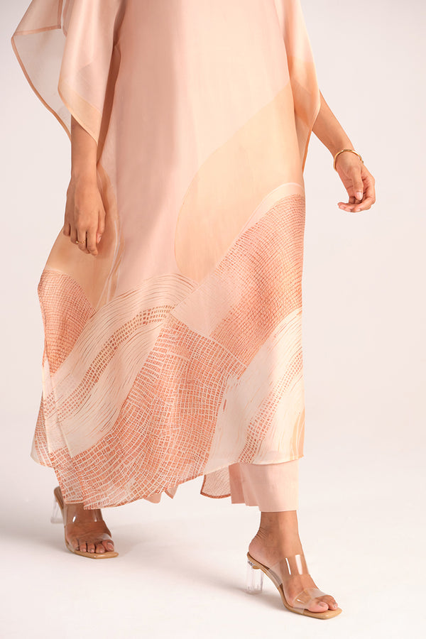 Woman wearing a Spanish Villa Silk Kaftaan Co-ord Set on a plain background