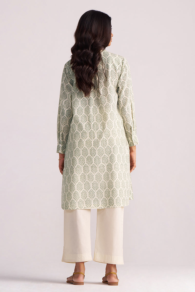 Woman wearing a Cream and Deep Olive Mughal Tree Hand Print Cotton-Linen Co-ord Set on a light gray background