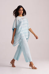 Woman wearing a Misty Blue Silk Kaftaan Co-ord Set on a white background