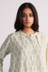 Woman wearing a Cream and Deep Olive Mughal Tree Hand Print Cotton-Linen Co-ord Set against a plain background