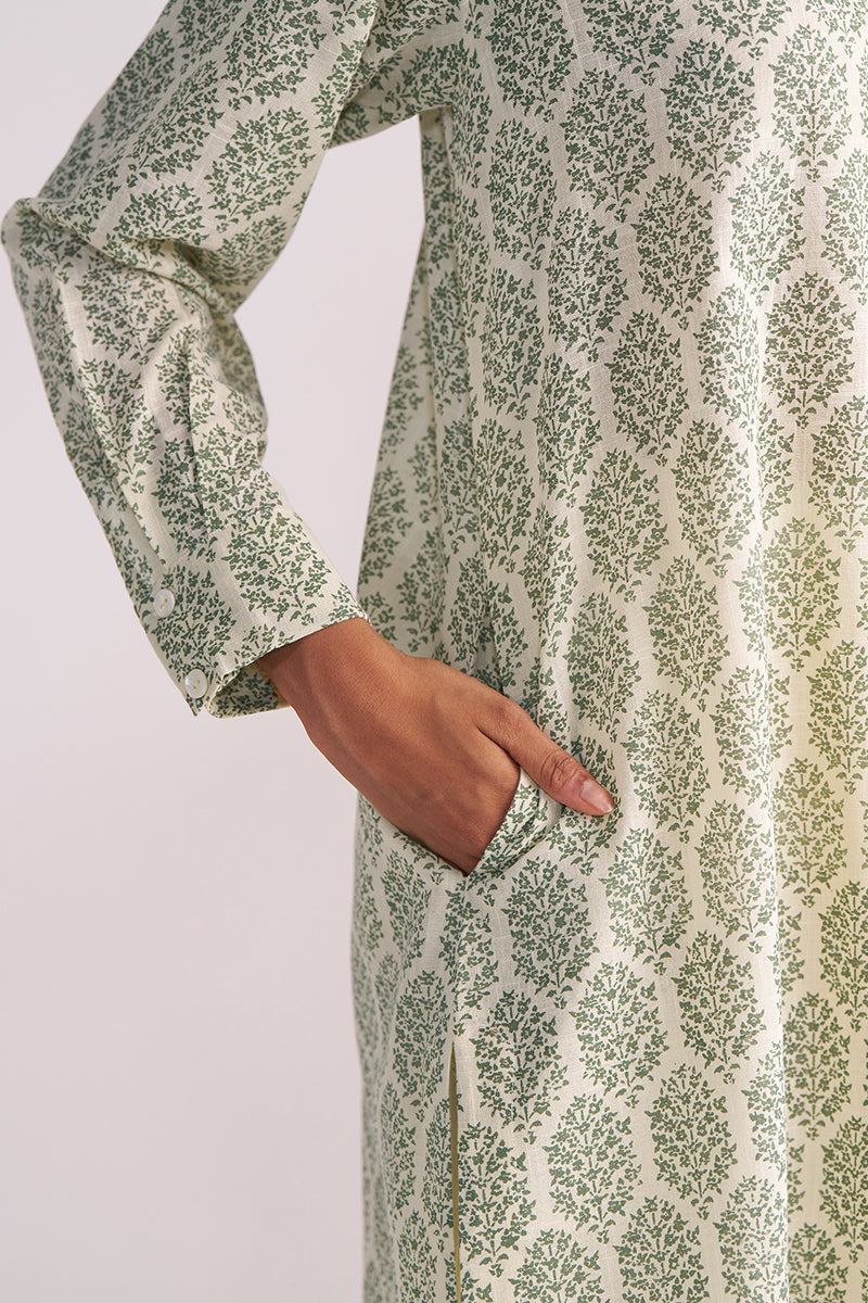 Cream and Deep Olive Mughal Tree Hand Print Cotton-Linen Co-ord Set with a hand in the pocket on a light gray background