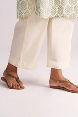 Person wearing Cream and Deep Olive Mughal Tree Hand Print Cotton-Linen Co-ord Set on a white background