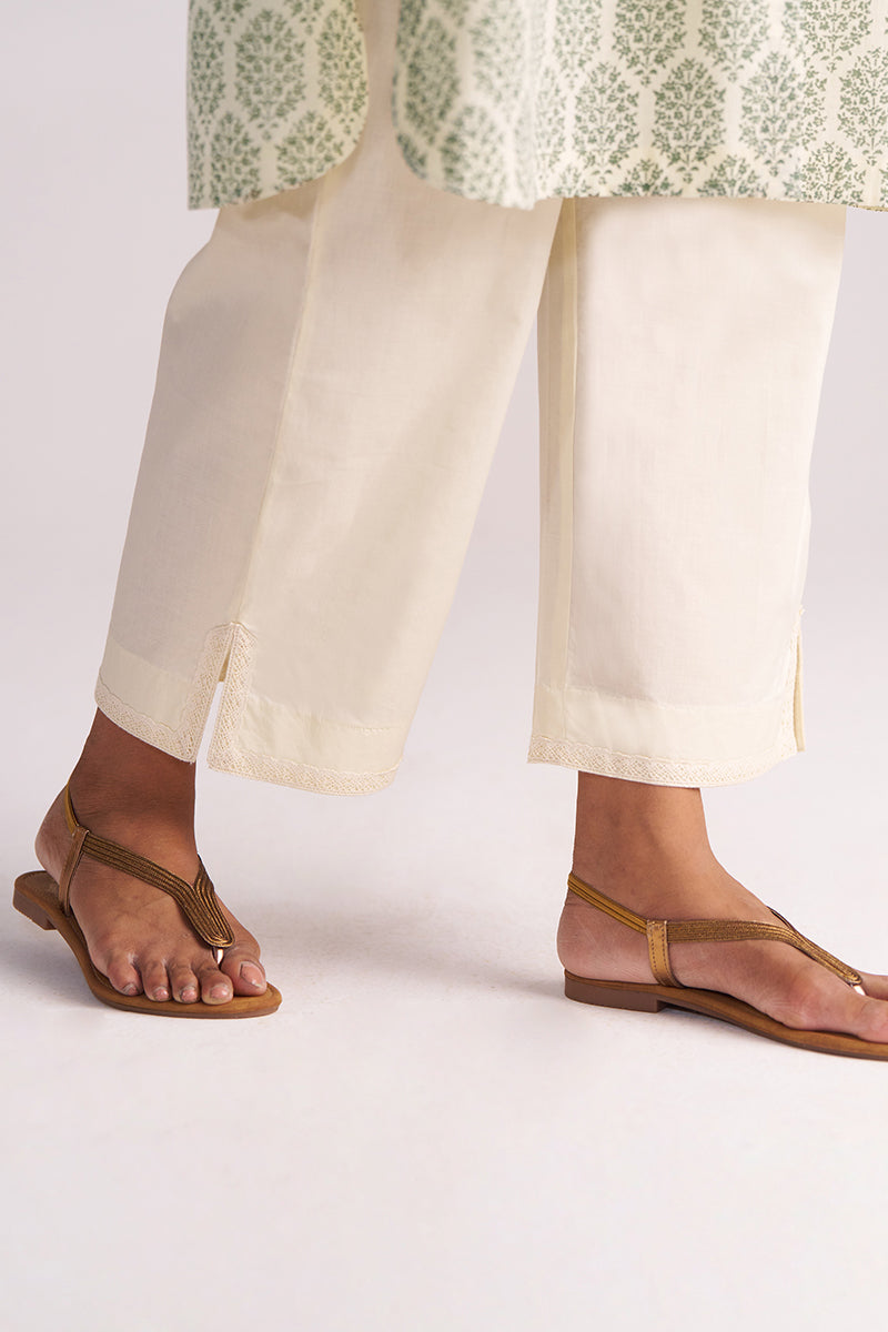 Person wearing Cream and Deep Olive Mughal Tree Hand Print Cotton-Linen Co-ord Set on a white background