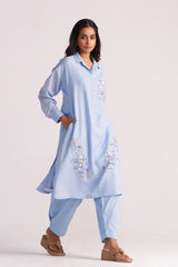 Woman wearing a Soft Sky Blue Mul-Mul Co-ord Set on a white background