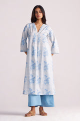 Woman wearing a Cream and Dusty Blue Hand-Print Cotton Co-ord Set with a plain background