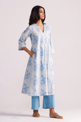 Woman wearing a Cream and Dusty Blue Hand-Print Cotton Co-ord Set on a white background