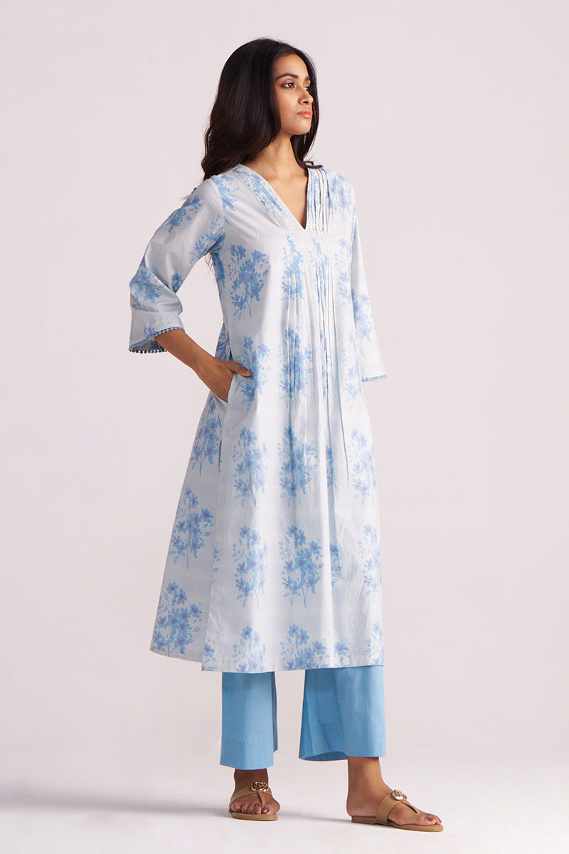 Woman wearing a Cream and Dusty Blue Hand-Print Cotton Co-ord Set on a white background