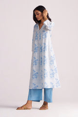 Woman wearing a Cream and Dusty Blue Hand-Print Cotton Co-ord Set on a white background