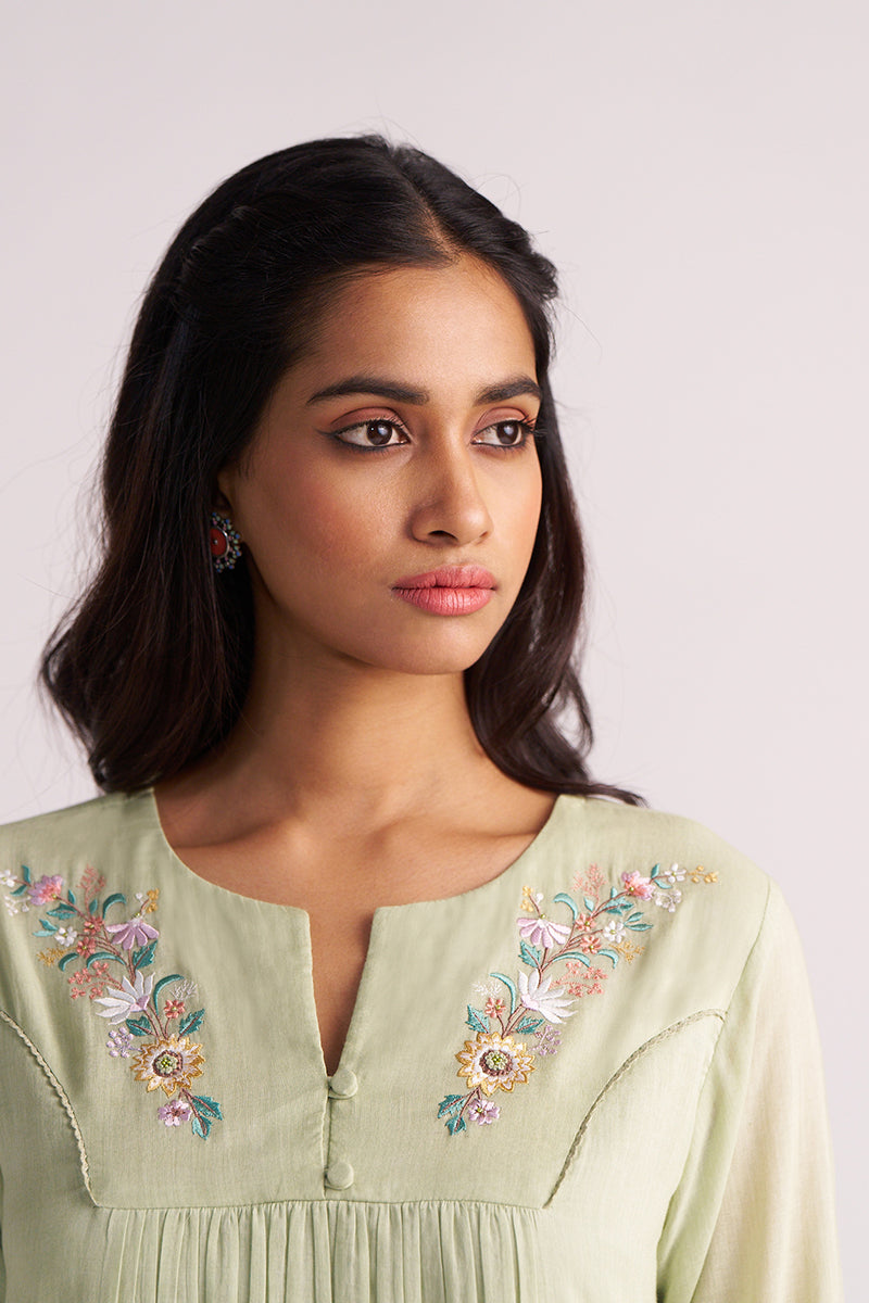 Woman wearing a Quient Green Mul-Mul Co-ord Set on a plain background