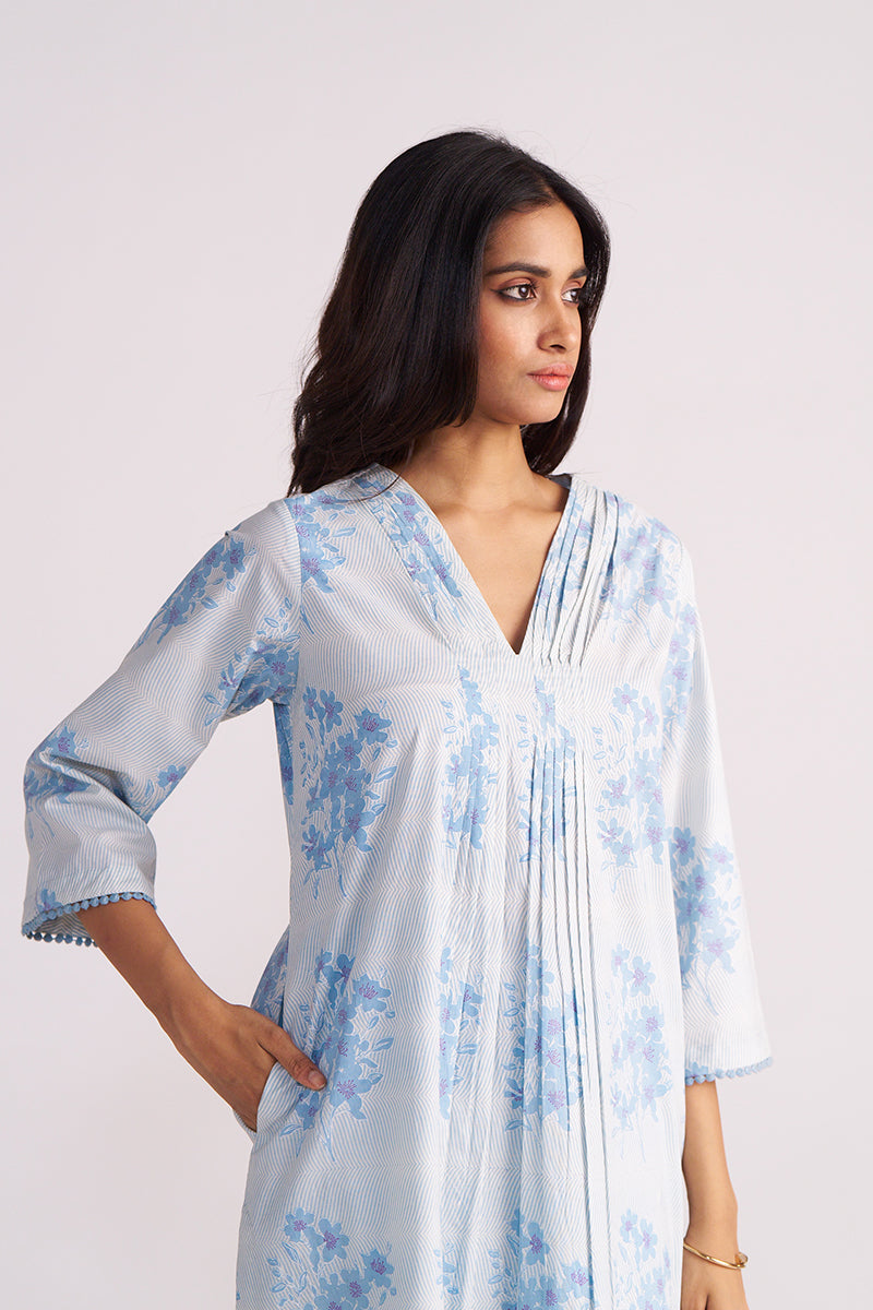 Woman wearing a Cream and Dusty Blue Hand-Print Cotton Co-ord Set on a white background