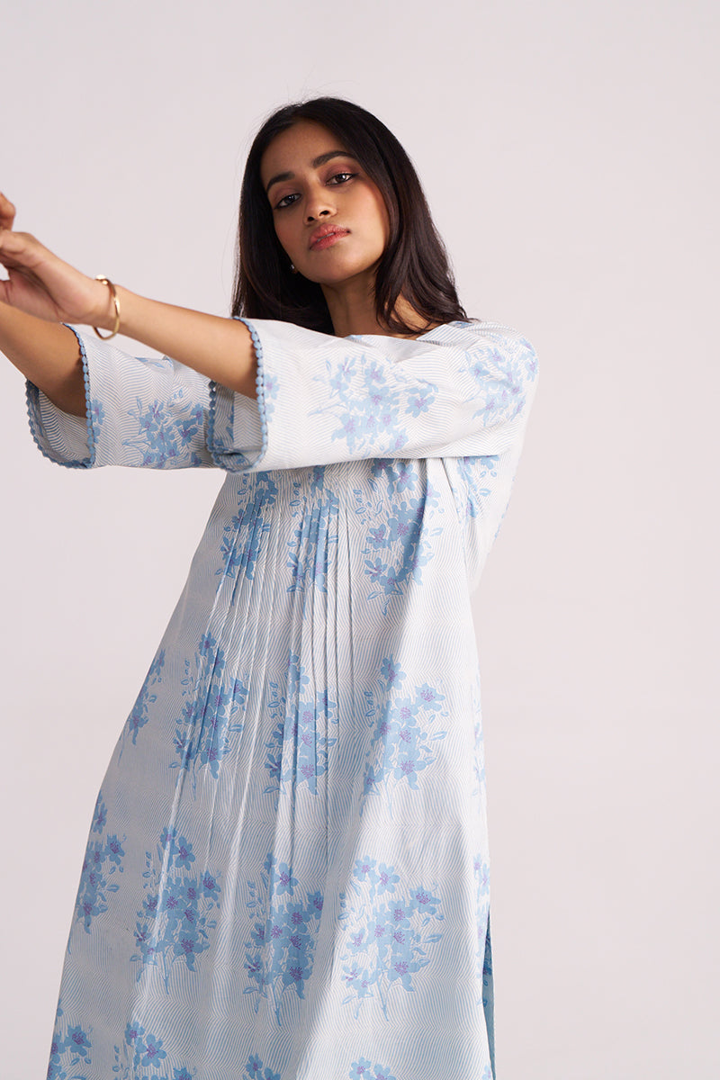 Woman wearing a Cream and Dusty Blue Hand-Print Cotton Co-ord Set with a plain background