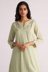 Woman wearing a Quient Green Mul-Mul Co-ord Set on a plain background