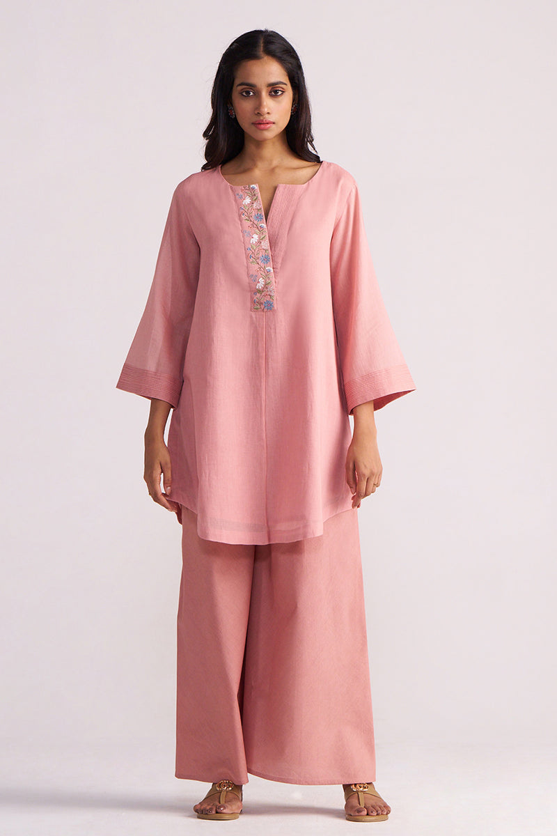 Woman wearing a Rose Tan Mul-Mul Co-ord Set on a light pink background