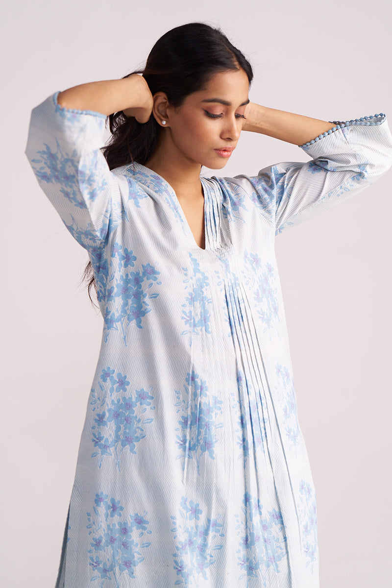 Woman wearing a Cream and Dusty Blue Hand-Print Cotton Co-ord Set against a light gray background