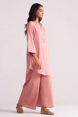 Woman wearing a Rose Tan Mul-Mul Co-ord Set with a plain background