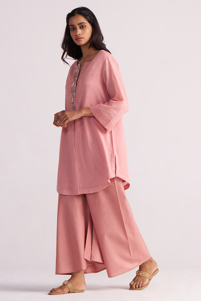 Woman wearing a Rose Tan Mul-Mul Co-ord Set outfit with a plain background