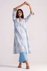 Woman wearing a Cream and Dusty Blue Hand-Print Cotton Co-ord Set with a plain background