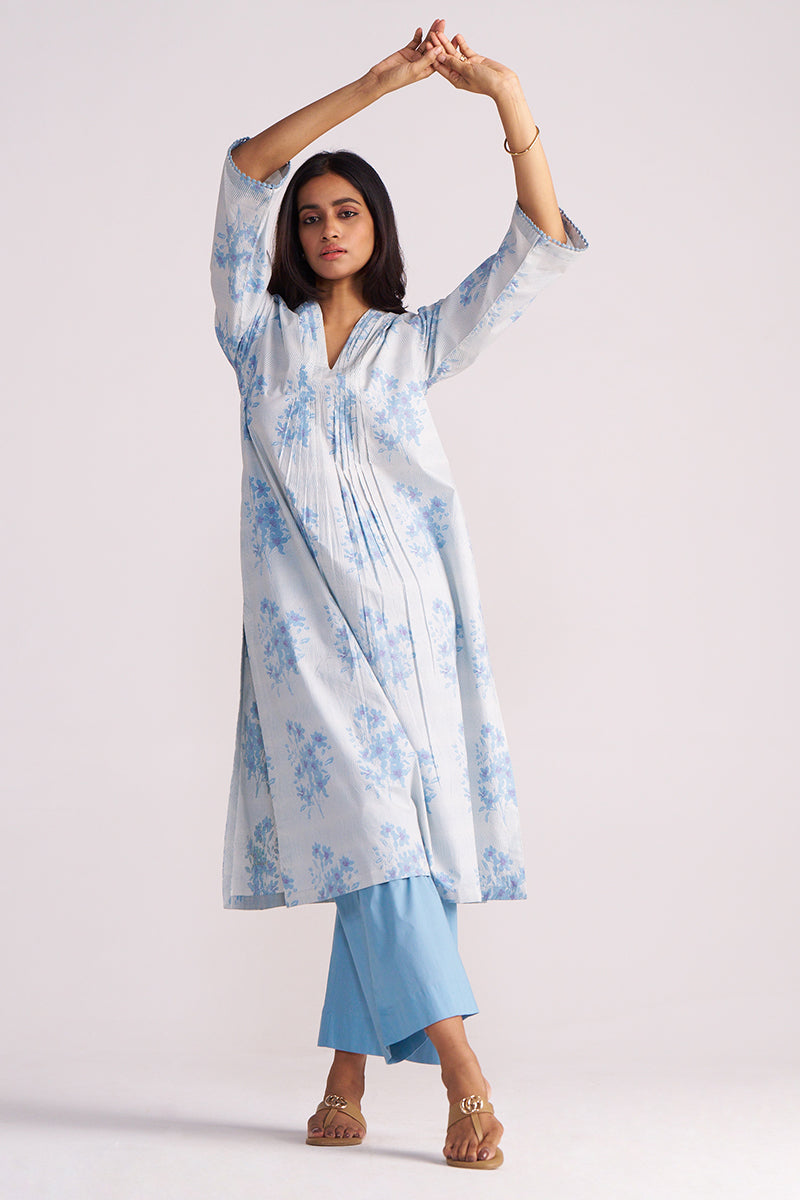 Woman wearing a Cream and Dusty Blue Hand-Print Cotton Co-ord Set with a plain background