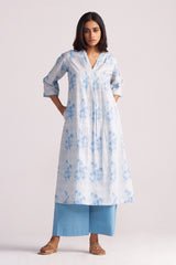 Woman wearing a Cream and Dusty Blue Hand-Print Cotton Co-ord Set with a white background