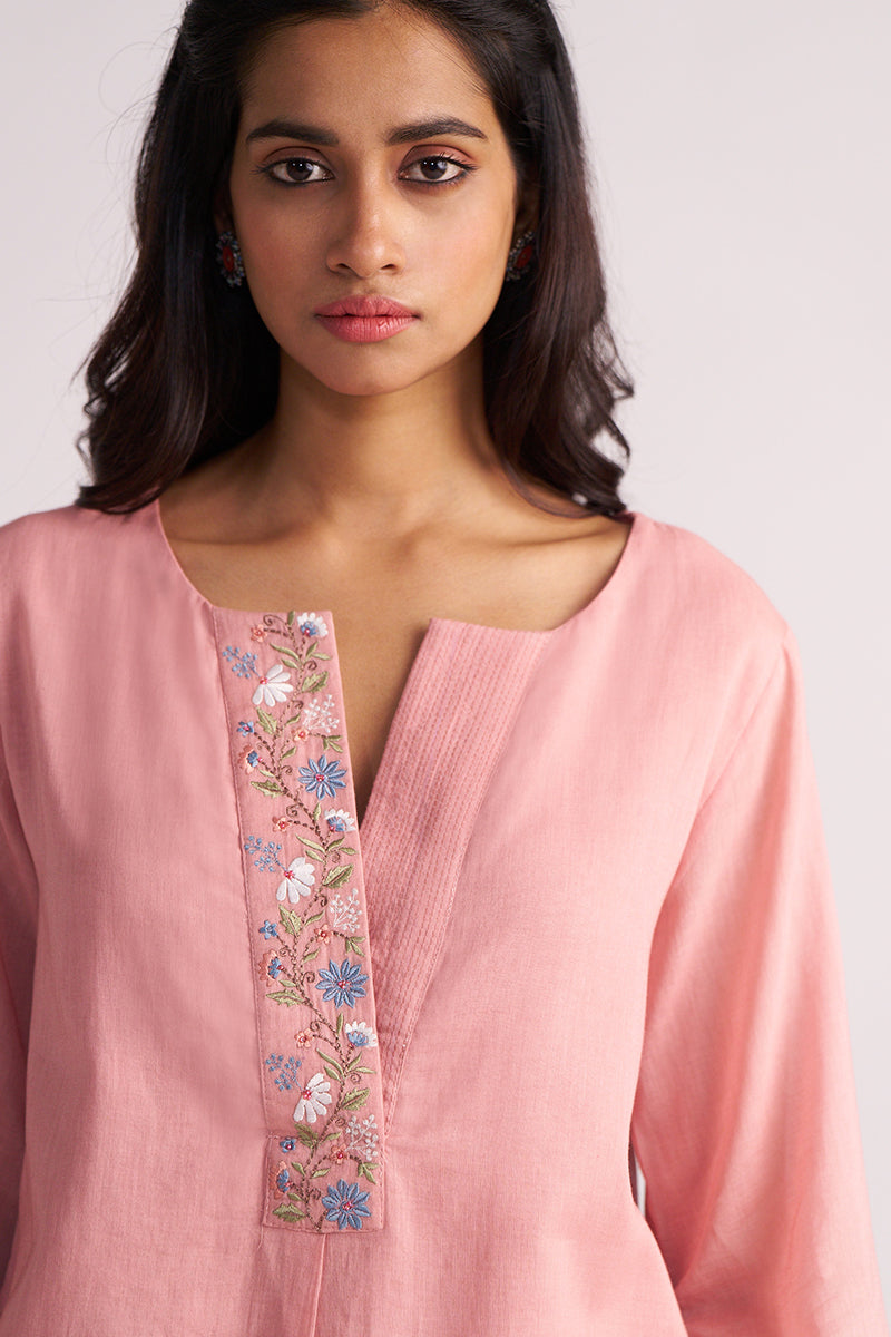 Woman wearing a Rose Tan Mul-Mul Co-ord Set with floral embroidery on a plain background